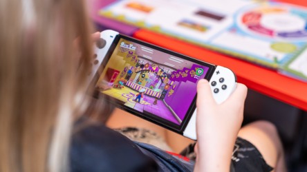 A girl playing Nintendo Switch.