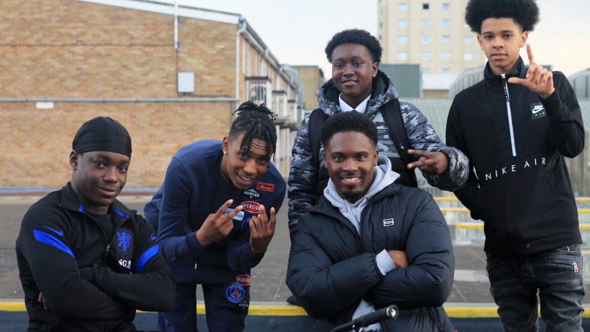 Amani Simpson with a group of young black boys