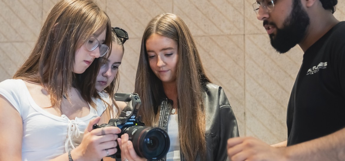 Group of girls working with a camera