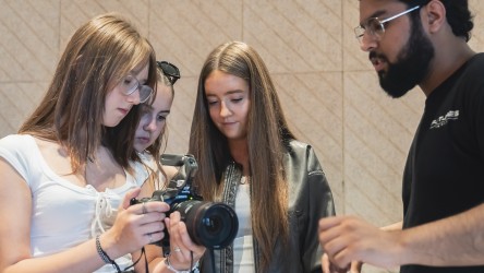 Group of girls working with a camera