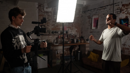 Image from ECAF project of youth leader and student filming.