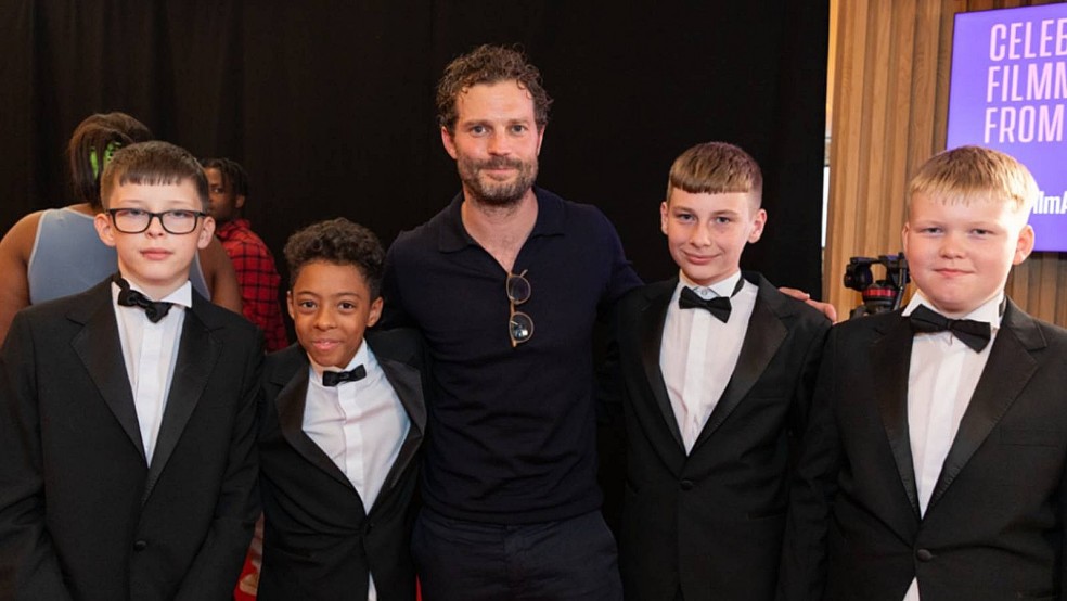 Jamie Dornan with Young people at the Into Film Awards 2024