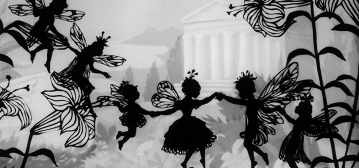 Black and white silhouettes of fairies in a garden