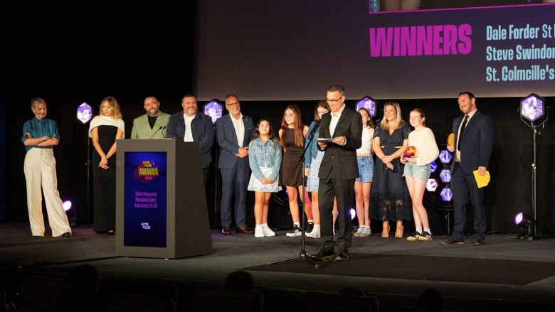 Filmmaking Champions winner Steve Swindon giving a speech on stage