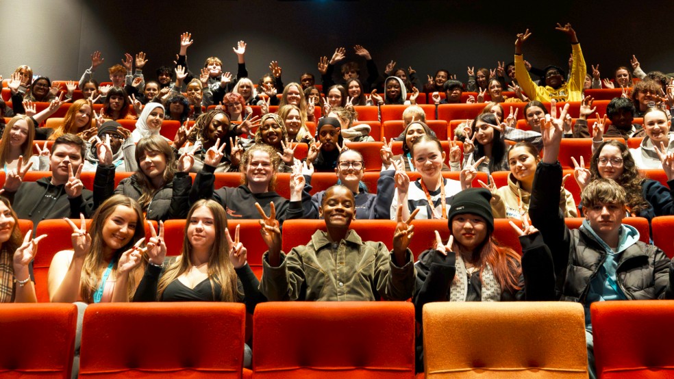 Letitia Wright poses with young people at HOME in Manchester
