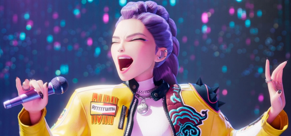 A young woman with purple hair and a yellow jacket sings into a microphone.