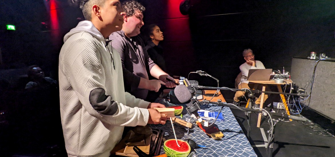 Young people creating Foley sound effects at the Into Film Festival 2025