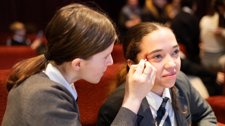 Young people applying wound sfx to one another