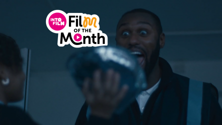 Person about to get a pie to the face with Film of the Month logo
