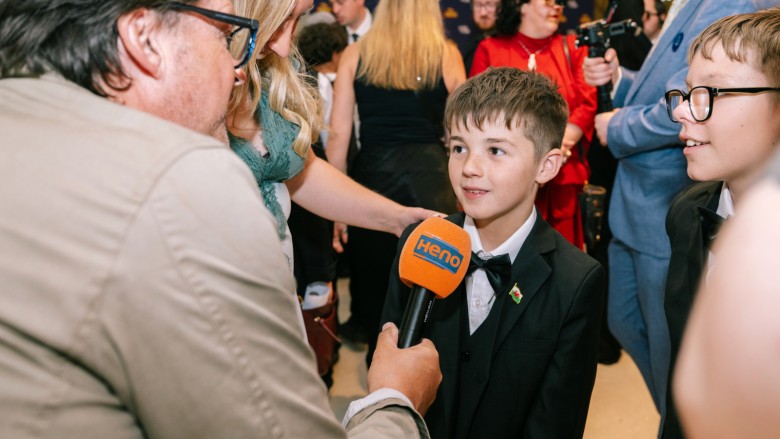 Young filmmakers from Caedraw Primary School being interviewed for Welsh TV