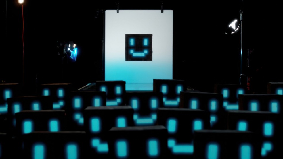 A crowd of black and blue pixelated smiley faces.