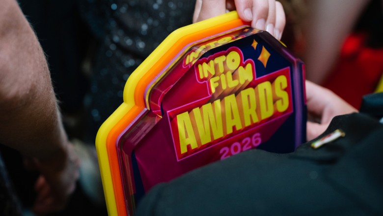 A winner clutching their trophy at the Into Film Awards 2026