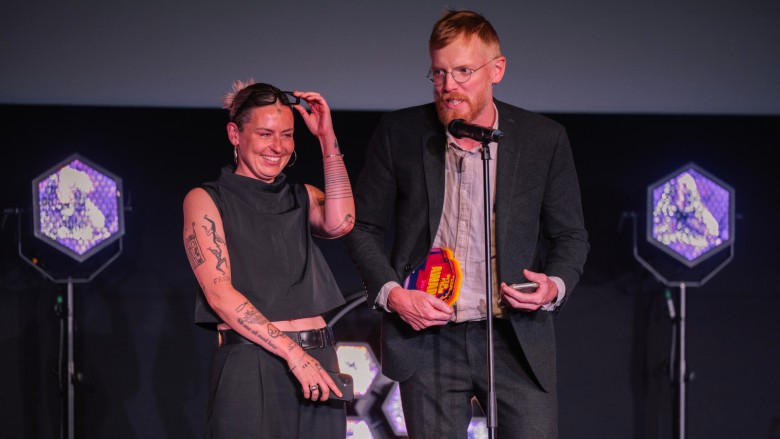 Filmmaking Champions Sophie Barnard and Will Davies on stage