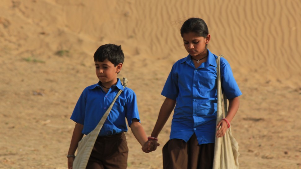 This image from Dhanak shows the characters holding hands in uniform.