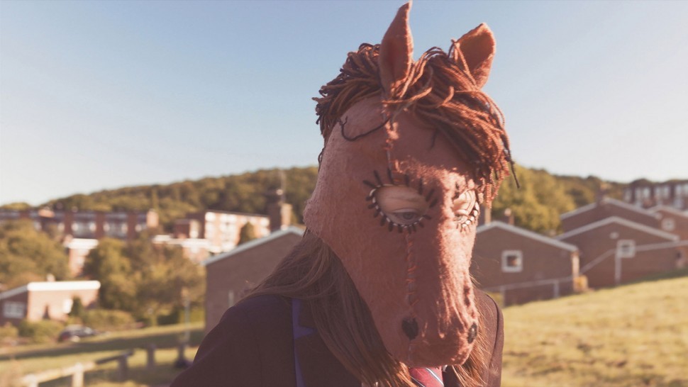 This image from Trigga shows the main character wearing her horse mask.