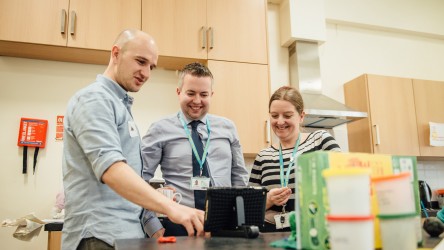 Teachers with iPad (Ferns Academy, Bolton)