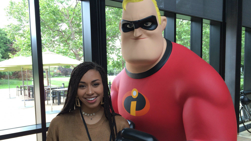 Annabella poses with a character at Pixar Animation Studios