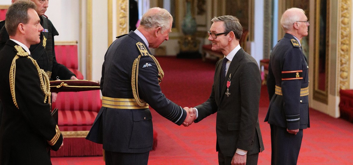 Into Film CEO, Paul Reeve receiving his MBE from Prince Charles