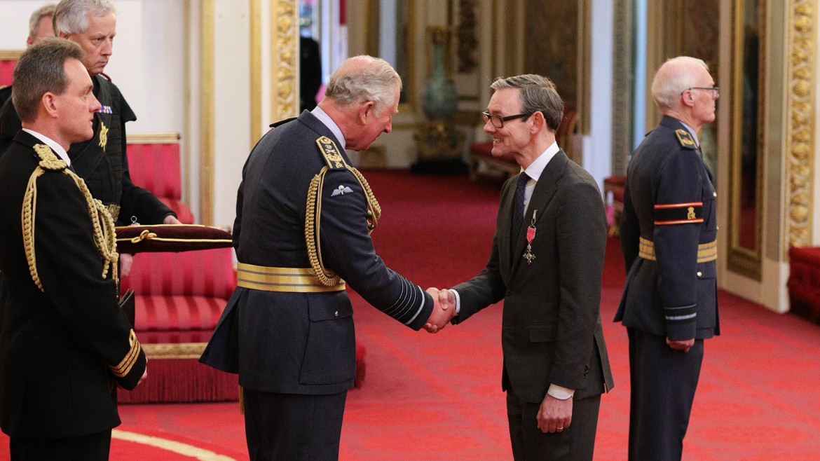 Into Film CEO, Paul Reeve receiving his MBE from Prince Charles