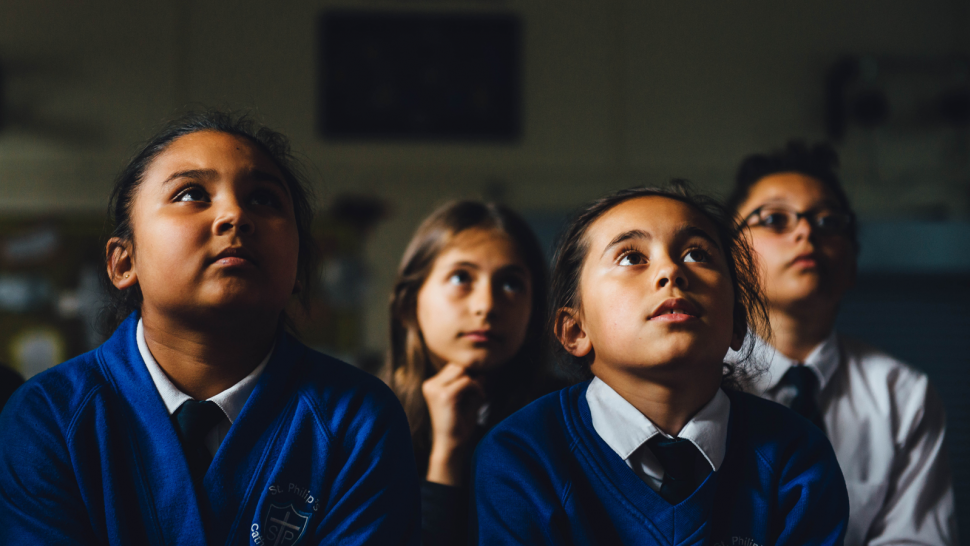 Group of children watching films in a club