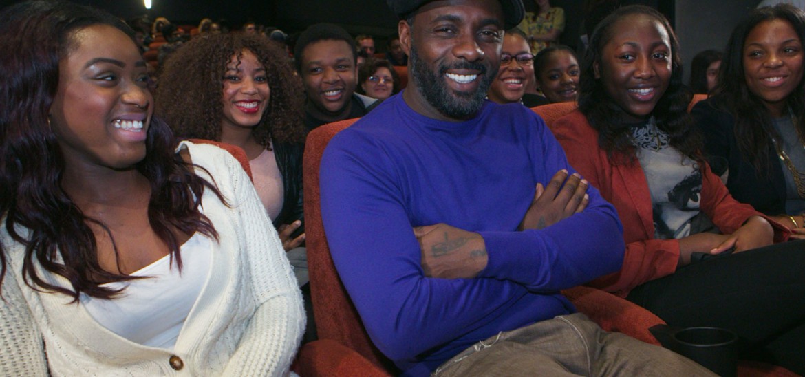 Idris Elba in cinema with young people