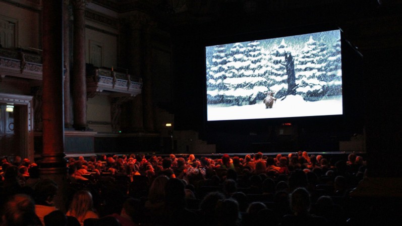 Full cinema of young people watching The Gruffalo's Child