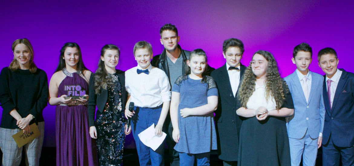 Jeremy Irvine and young people at the Into Film Awards