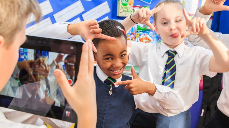 Young people at school making a film in their film club
