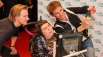 Jack Lowden and Eddie Redmayne take a selfie with young filmmaker Greta