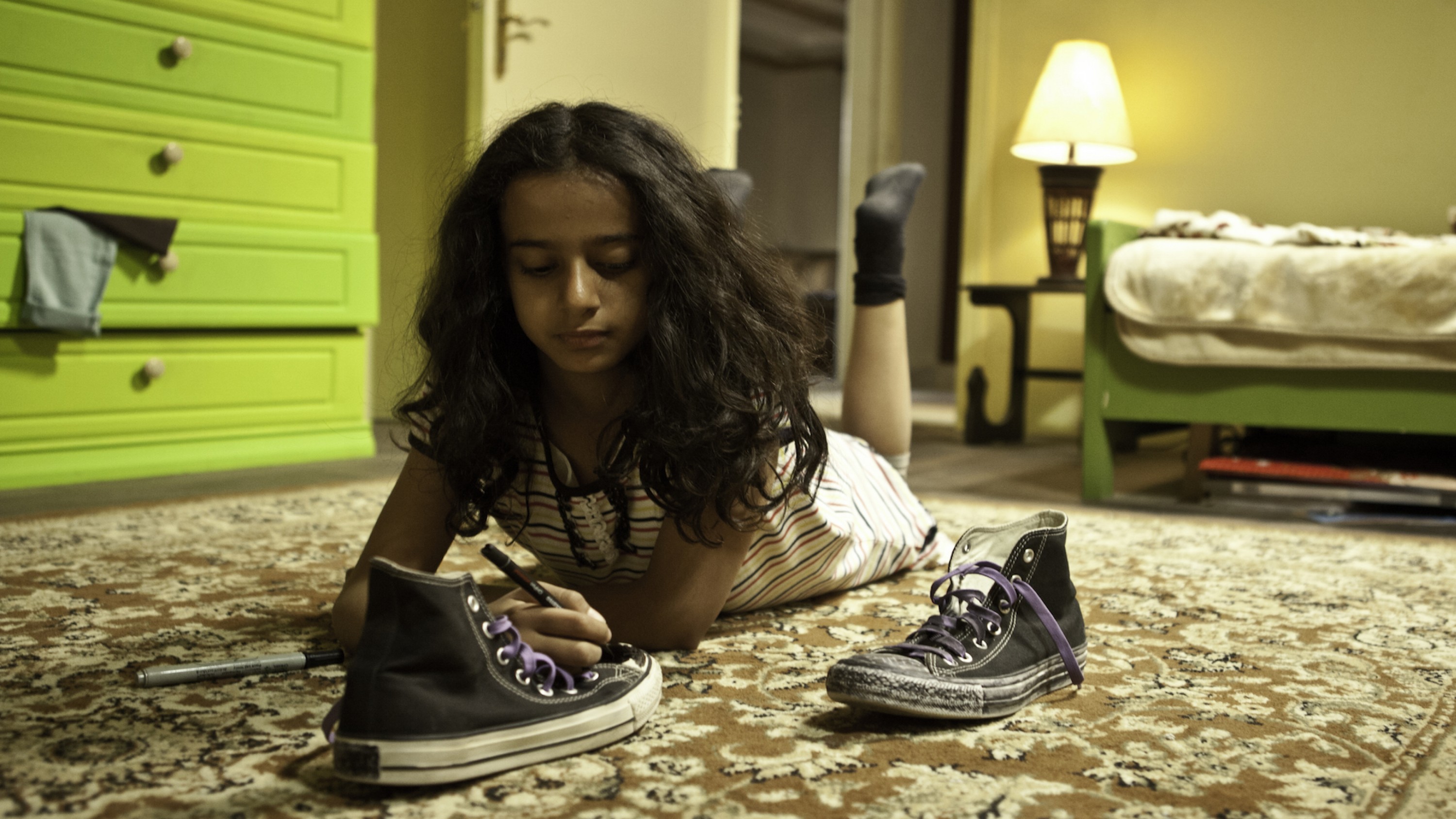 A film guide that looks at Wadjda (2012), exploring its key topics and them