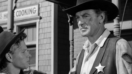 A film guide that looks at High Noon (1952), exploring its key topics and t