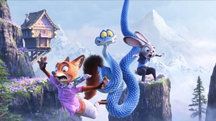 A fox, a rabbit and a snake fall through the sky in an alpine setting.