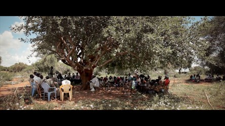 Kisilu speaks to his community about the importance of planting trees. thum