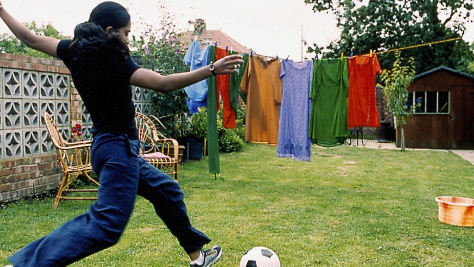 A film guide that looks at Bend it Like Beckham (2002), exploring its key t